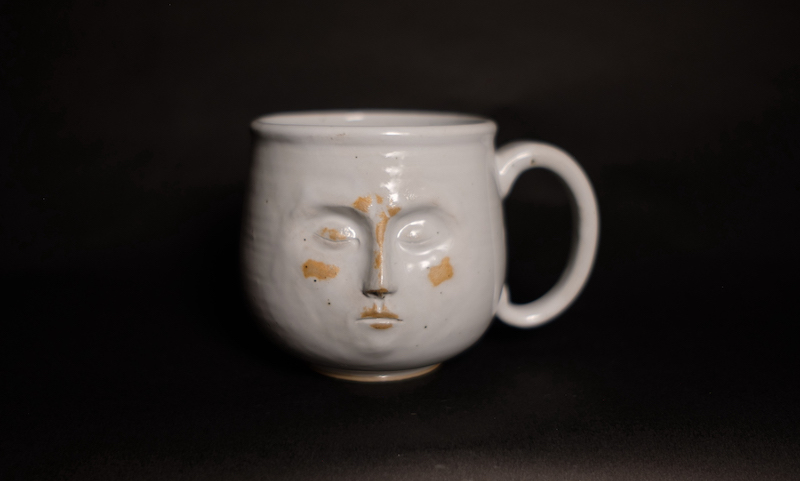 ceramic mug with face copyright S Robertson SLRCERMICS